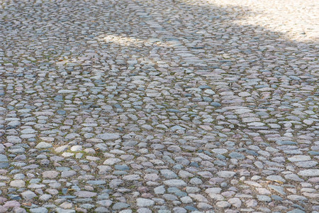 街道铺砌旧可腐石头背景一条有线状的老可碎石头路面的背景外部图片