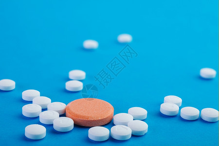 药片蓝底白橙和色药丸阿司匹林卫生保健图片