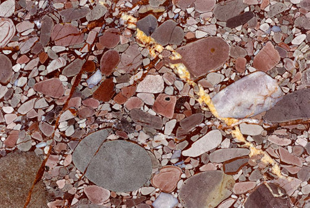 石灰缟玛瑙美丽的粉色装饰石背景和纹理表面裂缝斑点和污的抽象图案自然背景矿物质料学摘要地图片