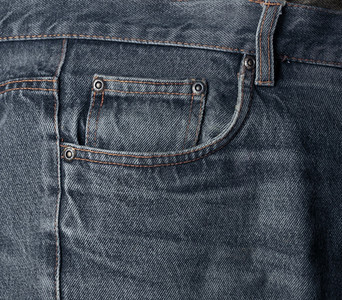 磨损的深色水洗牛仔裤口袋细节纺织品背景磨损的牛仔裤口袋细节布编织穿图片