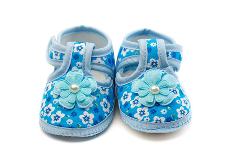 柔软度工作室一双蓝色婴儿鞋白的孤立脚步图片