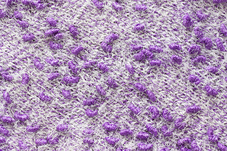 例子针织面料的质地纱线针织手工制作的彩色白和紫纱线图案背景针织面料的质地纱线针织背景一种围巾图片