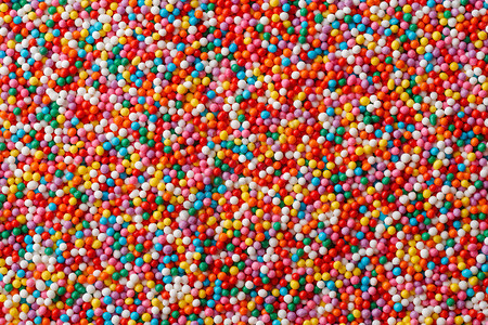 蓝色的背景和纹理有很多色糖果滴子甜食抽象摘要多彩糖果滴子千彩糖果滴子涂层斯克莱兹涅夫图片