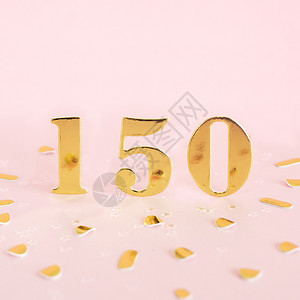 奖画新的数字在粉红背景和文本金面纸间距上是150个黄金数字图片