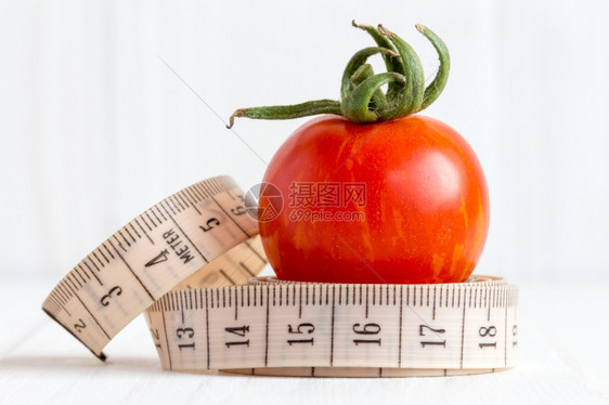营养腰部一种用个小红番茄水果的测量磁带图片