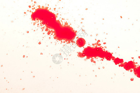 刷子湿的喷白色背景上红滴关闭图片