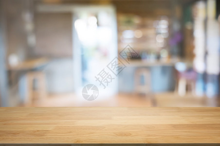 最佳咖啡店餐厅背景模糊的咖啡厅面前空木板桌图像可以是摆放产品嘲笑老的图片