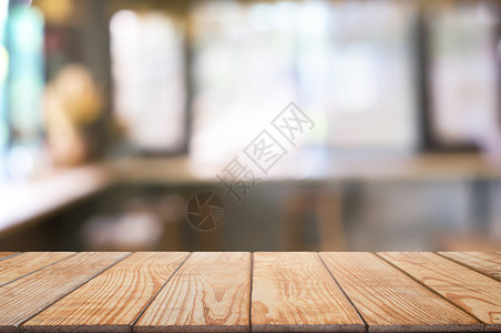 剪辑咖啡店餐厅背景模糊的咖啡厅面前空木板桌图像可以是摆放产品棕色的抽象图片