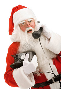 白种人族红色的圣诞老人在电话上讲关闭图片