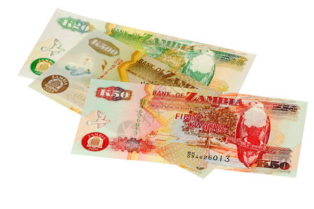 买银行业货币赞比亚的一堆钱是白种背景孤立无遗的图片