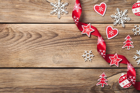 圣诞背景木制桌子上有雪花和红装饰的色装饰质地假期白色的图片