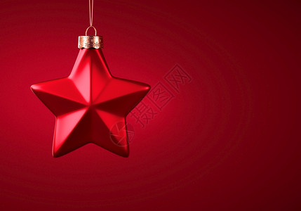 绳索颜色装饰风格红五点明星圣诞装饰品红五点明星圣诞装饰品红色的黄挂在金线上与布贡迪红色遮雨背景圣诞礼章喜庆气氛概念复制空间图片