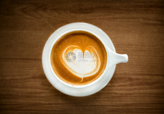 卡布奇诺咖啡店可选择的木桌顶视图上热咖啡拿铁杯图片