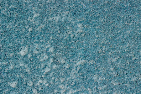 水泥混凝土墙碎片涂有蓝漆作为背景或纹理的混凝土壁垃圾摇滚质地图片