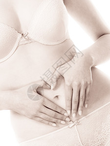 子宫身体护理和怀孕部分身体女在她的腹部创造心脏标志符号女手在光滑的肚子上做出爱姿态女手在腹部形成心脏状脐胃图片