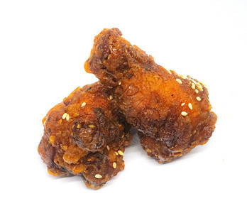 香辣和酸酱的韩国式炸鸡孤立于无背景中翅膀健康枝条图片