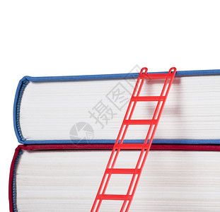 白色背景的红梯子书孤立在白色背景上精装学校知识图片