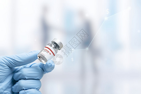 横幅手持有疫苗药瓶的医疗手套铝玻璃图片