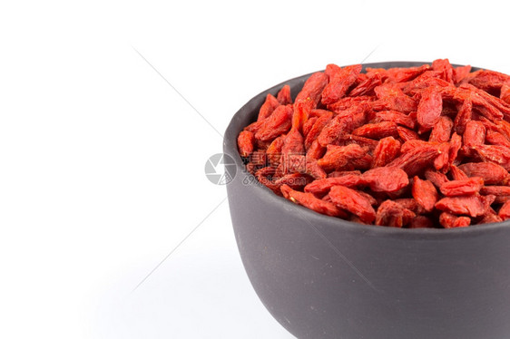 营养丰富红色的黑石头碗果子浆紧贴白色背景草本植物图片