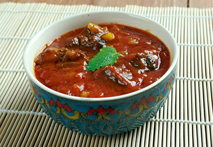 罗根烹饪热的Laalmaans来自印度Rajasthan的咖喱肉印度羊咖喱配有酱汁和热辣香料如红椒图片