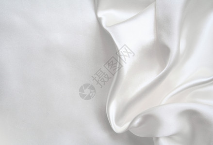 美丽的缎白色平滑优雅白色丝绸可用作婚礼背景图片
