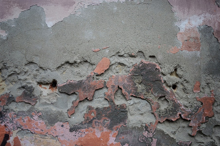防风混凝土墙有损坏的沙土和旧油漆陈年肮脏的毁坏图片