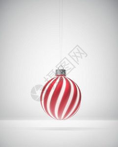 红色的电灯泡马特红白条纹圣诞装饰品挂在白色背景上挥舞着圣诞节的灯光装饰庆气氛概念单身的图片