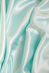 柔软的平滑优雅蓝色丝绸可用作背景纺织品天上图片
