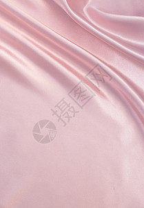 天蓝色曲线缎面平滑优雅的粉色丝绸可用作背景图片