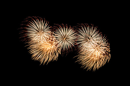明亮的金色和红爆炸烟花展示以黑色背景隔开喜庆的金图片素材