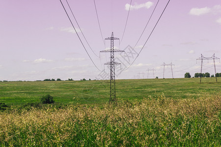 传送电气植物农村城市外田地的电力线背景图片