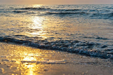 地平线阳光海洋上日落岸出上落图片
