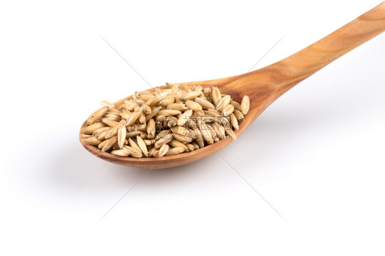 木勺中在白色背景上孤立的有机燕麦粒健康自然白色的图片
