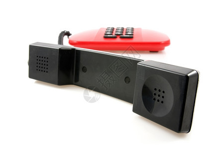 老的单身红色电话在白背景上带黑接收器电气图片