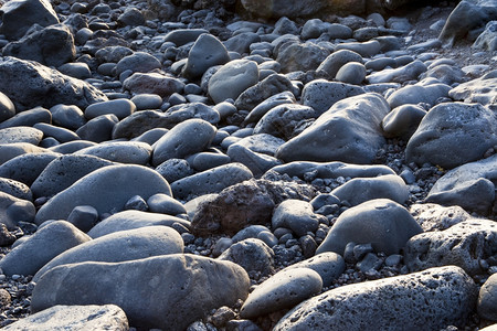 和谐抽象的黑色兰萨罗特海滩岩石背景图片