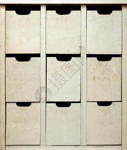 陈年灰色的文件柜背景和纹理非常古老的有染色和风化木制柜子内有抽屉前视近身拍摄的旧木制柜子图片