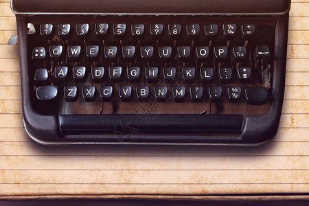 纸面背景的老式打字机键盘新闻业空白的酒吧图片