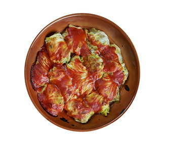 Holishkes传统的犹太菜卷土豆碎屑叶用包裹式装的方在肉和番茄酱上白饭一顿洋葱图片