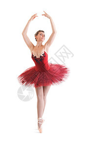 灵活红色的女孩白背景古典芭蕾舞裙中的美丽芭蕾舞女图片