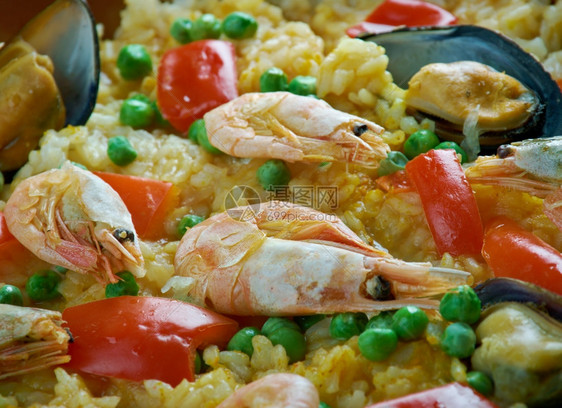 贝类来自西班牙东北部的PaelladeCatalan传统海鲜菜一顿饭煮熟的图片