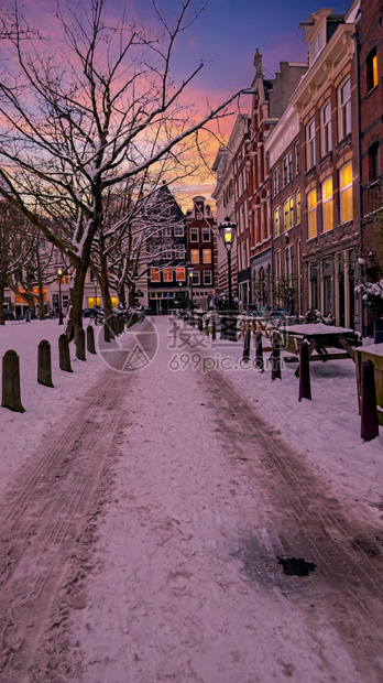 人们荷兰欧洲日落时冬季的寒下雪阿姆斯特丹城市寒冷的图片