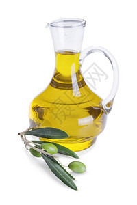 处女水果玻璃瓶装橄榄油和新鲜树枝白本上孤立的橄榄图片
