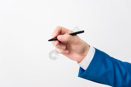 按男抓住白色背景上方的孤立手握笔中白色背景上方的指点笔白色背景上方的孤立手握笔中白色背景上方的指向笔商业概念与白色背景上方的复制图片