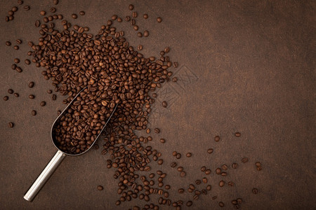 咖啡背景豆和棕色背景勺顶视图复制空间品尝店铺种子图片