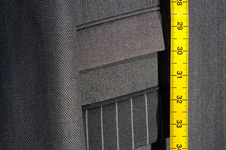 夹克行业缝纫配有黄磁带测量器的平板商业西装图片