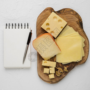 美味的奶酪拼盘空白螺旋奶制品带笔背景平淡安全的墙纸身体图片