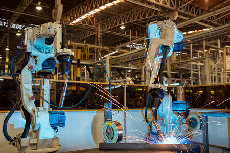 工业机器人是汽车厂部分的焊接组装技术工程机械的图片