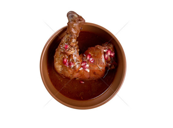 东方的Fesenjan波斯烹饪菜中用石榴糖浆和地核桃制成的花生炖肉中Khoreshefesenjn菜蔬图片