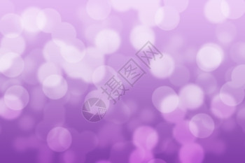 圆圈闪发光紫和bokeh背景摘要圆环美丽的图片