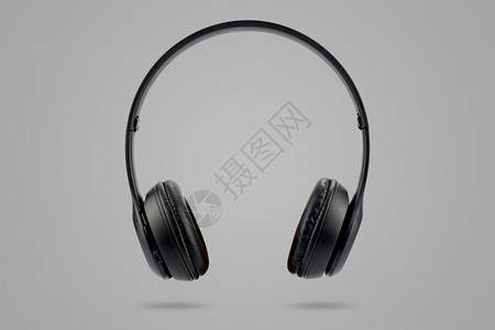 未来无线的单身现代设计在灰色糊面背景上隔离的黑色无线耳机现代设计图片